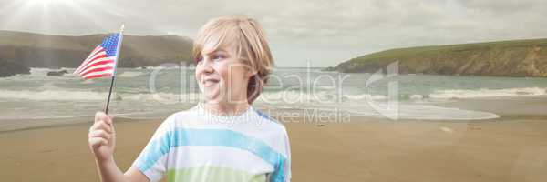 Boy with american flag on beach with flare
