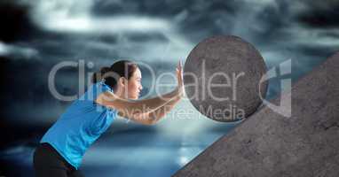 Woman pushing 3D rolling round rock