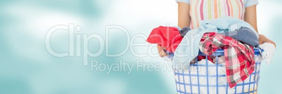 Cleaner holding laundry basket with bright background