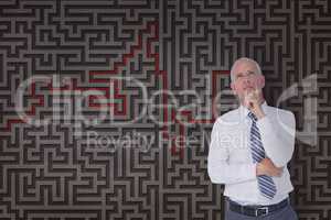 Man thinking against a maze background 3d