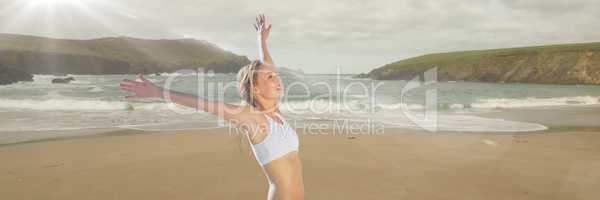 Woman in underwear celebrating on beach with blur