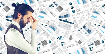 Frustrated business man against document backdrop