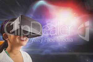 Happy girl in VR headset looking up against black, purple and red galaxy background