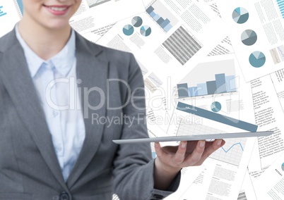 Business woman mid section with tablet against document backdrop