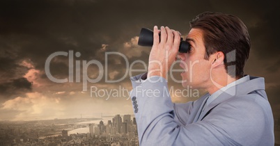 Businessman with binoculars in dramatic city