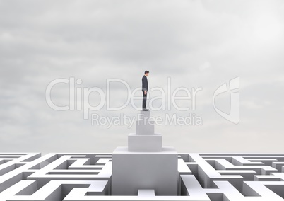 Man looking down on a maze against a sky with clouds 3d