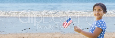Girl with american flag on beach