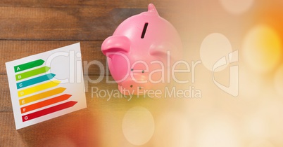Piggy bank and chart with orange bokeh copy space transition