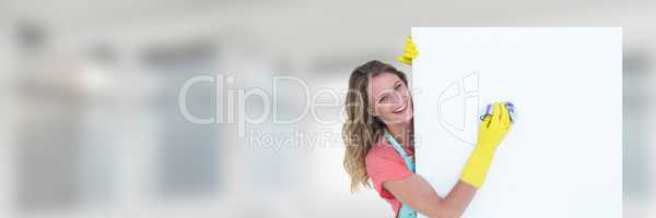 Cleaner holding white board with bright background