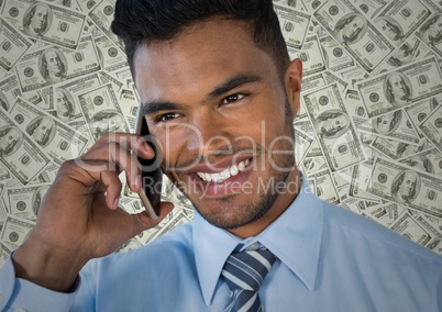 Close up of business man on phone against money backdrop