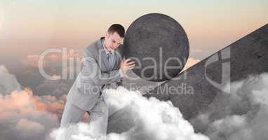 Man pushing rolling round rock