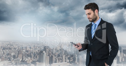 businessman with phone in cityscape