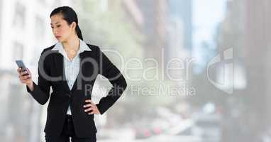businesswoman on phone in cityscape