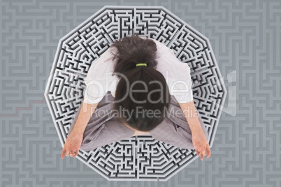 Woman meditating on a 3D maze