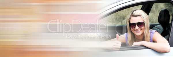 Woman in car with thumbs up with copy space transition