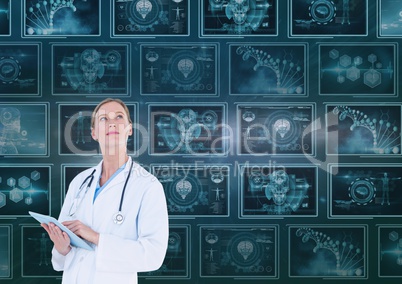 Woman doctor looking up against background with 3d medical interfaces