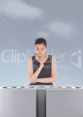 Woman looking at a 3d maze against a sky with clouds