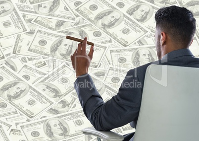 Back of business man in chair against money backdrop