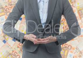 Business woman mid section hands together against money backdrop