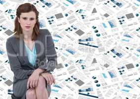 Business woman sitting against document backdrop