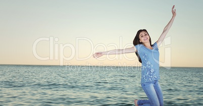 Woman celebrating against water and evening sky 3d