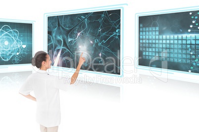 Woman doctor interacting with medical interfaces against white background 3d