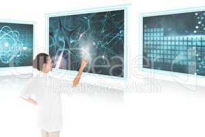 Woman doctor interacting with medical interfaces against white background 3d