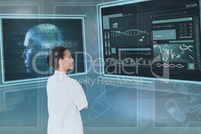 Happy woman doctor looking at 3d medical interfaces