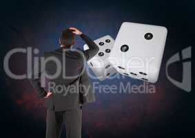 Back of Man Looking at 3d pair of dice