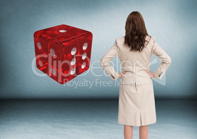 Back of woman Looking at 3d dice