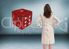 Back of woman Looking at 3d dice