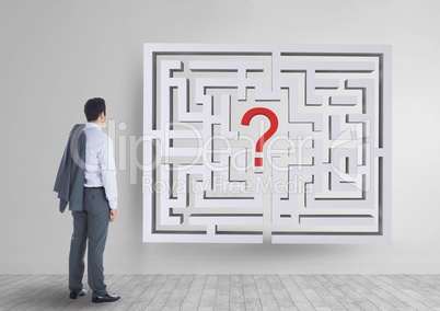 Man looking to a 3d maze on the wall