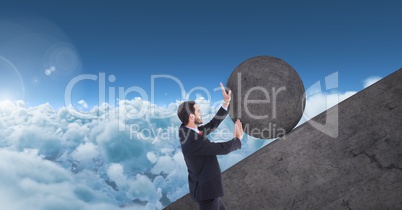 Man pushing rolling round rock