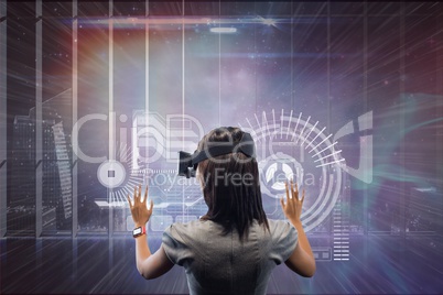 Woman in VR headset touching interface against galaxy and city background