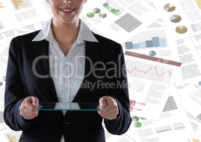 Business woman mid section with glass tablet against documents backdrop