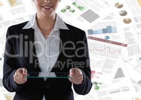 Business woman mid section with glass tablet against documents backdrop