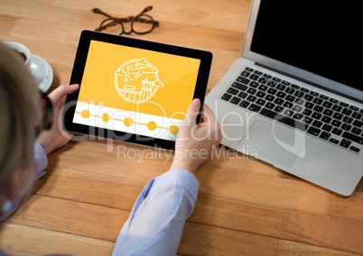 Person holding a tablet with travel icon on the screen