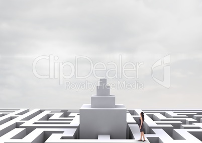Woman looking up on a 3d maze against a sky with clouds