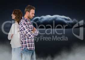 Couple facing back to back and upset with clouds