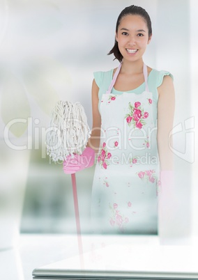 Cleaner holding mop with bright background