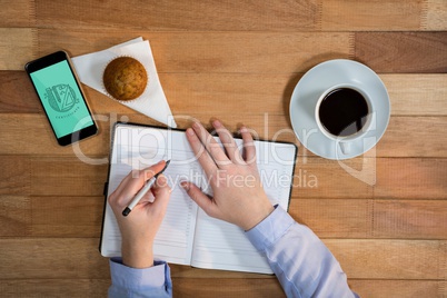 Phone with education icon on the screen on wooden desk