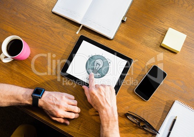 Person using a tablet with education icon on the screen