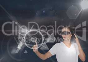 Woman in VR headset touching interface against black sky with stars and flares