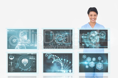 Woman doctor interacting with 3d medical interfaces against white background