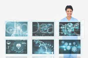 Woman doctor interacting with 3d medical interfaces against white background