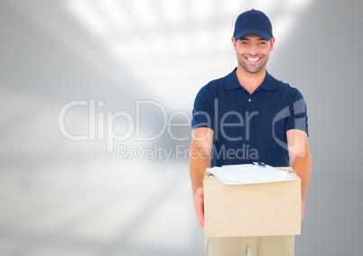 Delivery Courier with box in front of blurred background and copy space