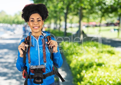 Millennial backpacker against blurry campus