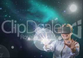 Woman in VR headset touching interface against green and purple space background with flares