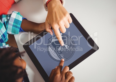 Boys holding a tablet with travel icon on the screen