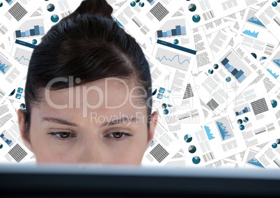 Close up of woman at computer against document backdrop